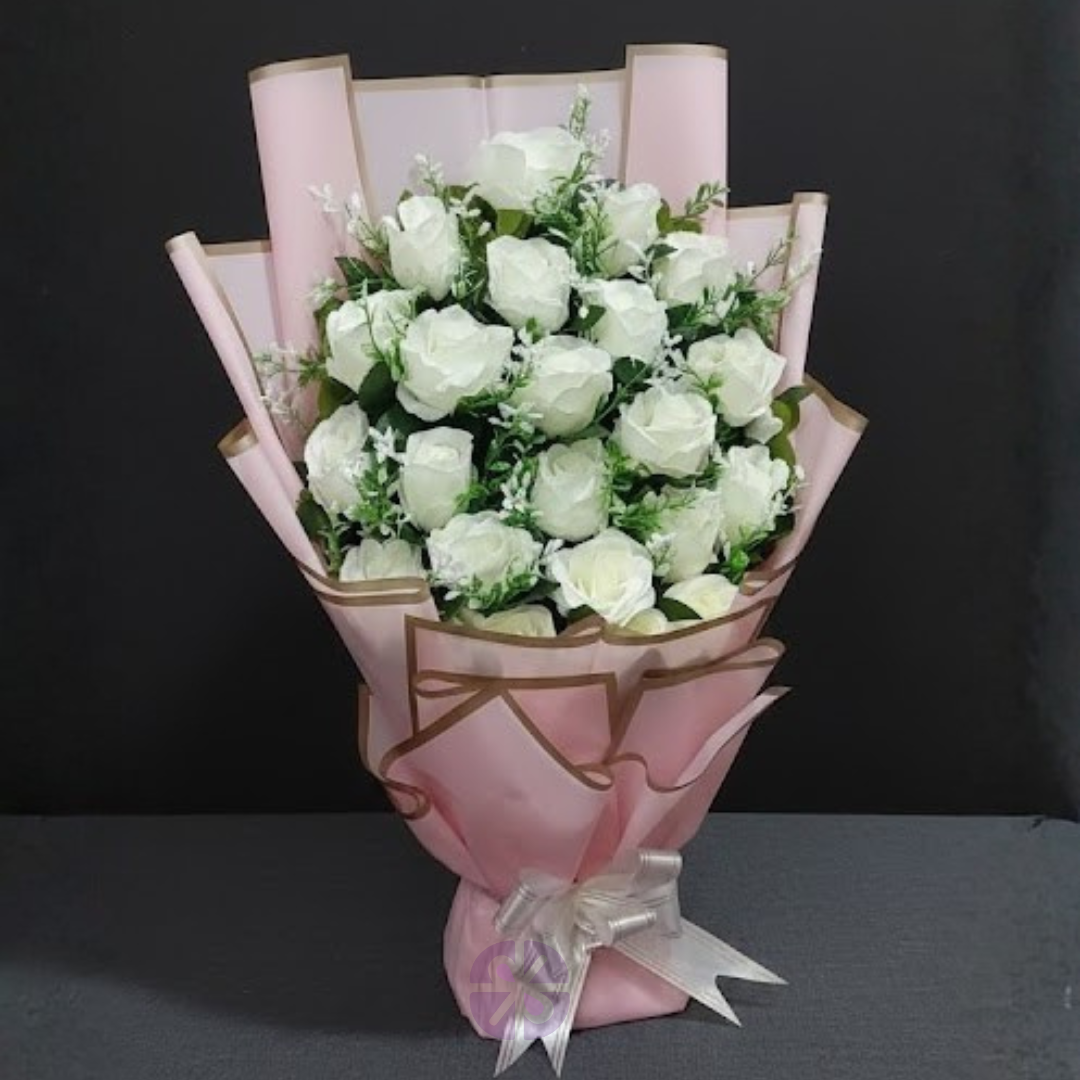 Sweet Serenity Artificial White Rose Stand Bouquet in Pink Wrap