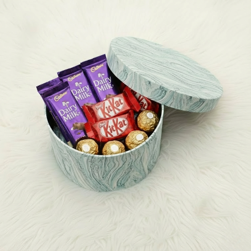 Mixed Chocolate Collection in Elegant MarbleTextured Round Gift Box